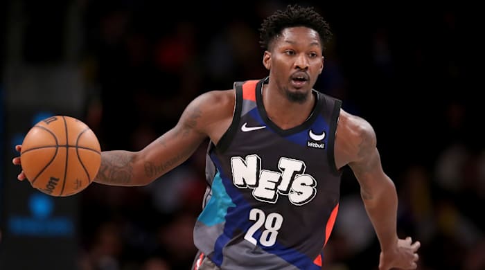 Brooklyn Nets forward Dorian Finney-Smith brings the ball up court against the New York Knicks during the fourth quarter at Barclays Center in New York City on Dec 20, 2023.